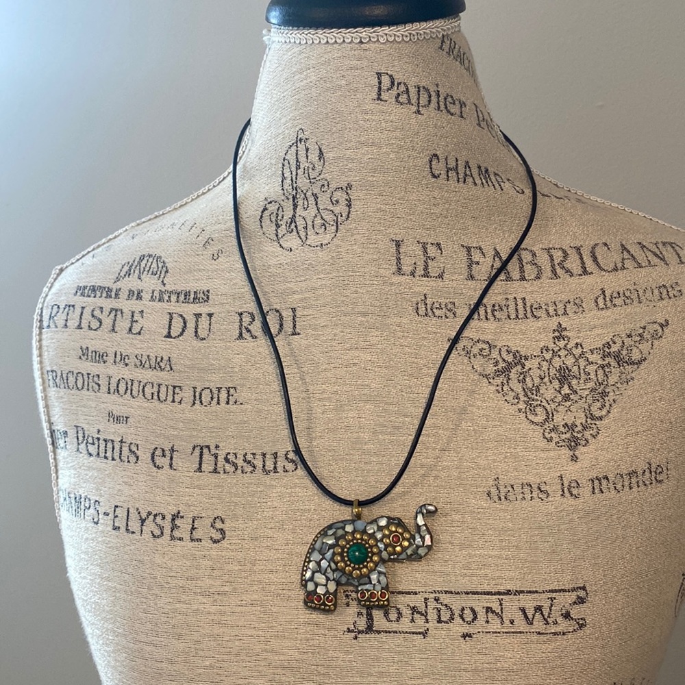 3/$15 Elephant charm on a leather strap approximately 13 inches long